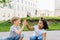 Two friendly dark-skinned and white children diverse positive boy and girl stand hugging. children concept