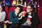 Two friends, brothers drink through a tube in the cinema
