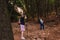 two friends climbing to the top of a mountain. young women on vacation. women using binoculars, bird watching.