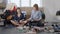 Two friends decided to arrange a wardrobe. Women were tired and sat on the floor to relax and read a magazine.