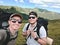 two friends hikers taking selfie at mountains peak