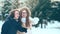 Two friends met in the Park in the winter. They`re laughing
