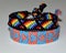 Two friendship bracelets, woven of thread, with ties and pattern of the rainbow flag,  known as the gay pride flag or LGBT pride.