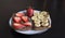 Two fruit sandwiches with chocolate paste, banana and strawberry