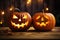 Two funny angry Halloween pumpkin head jack lantern candles burning fire