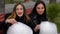 Two funny girlfriend eat cotton candy and laugh
