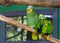 Two funny and happy blue fronted parrots, sitting on a branch together, tropical pets from America