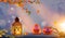 Two funny scary orange pumpkins with glowing eyes on wood and lantern at halloween evening