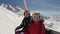 Two Funny Skiers Fooling Around Sitting On The Ski Lift In Winter Mountain