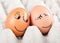 Two funny smiling eggs in a packet