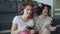 Two funny women play console games with gamepad and have fun at home