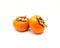 Two Fuyu persimmon isolated