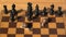 Two garden burgundy snails on wooden chessboard playing in chess