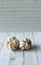 Two Garlic on a wooden patterned table