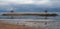 Two gazebo at the beach of Sanur. Storm clouds in the background