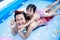 Two generation people swimming in Inflatable Pool at the summer time