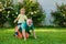 Two generation - weekend together. Child with father dreams in summer in nature. Father with son in park. Old father