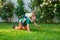 Two generation - weekend together. Happy father and son on meadow in summer. Grandfather and grandson Playing - Family