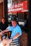 Two gentlemen enjoy al fresco dining in Boston`s North End