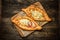 Two Georgian khachapuri close-up on the table.