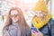 Two girl friends in the street in winter clothing