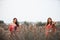 Two girlfriends in colorful scarf clothes, outdoors portrait.