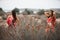 Two girlfriends in colorful scarf clothes, outdoors portrait.