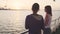 Two girlfriends dancing on the deck of the ship at sunset