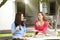 Two girlfriends sitting outside having lunch