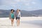 Two girlfriends walking and talking on the beach