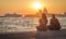 Two girls admire the scenic sunset over Santa Maria della Salute in Venice