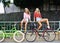 Two girls with a bikes outdoor portrait