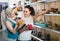 Two girls choosing shoes in the store