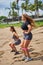 Two girls do fitness on the beach