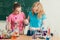 Two girls doing chemical experiments