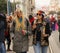 Two girls dressed as in the 70s laughing in the street