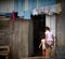 Two girls entering in their house, Costa Rica