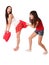 Two girls fighting on the pillows