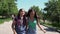 Two girls girlfriends running around holding hands having a good mood. slow motion