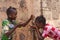 Two Girls Happily Sharing Water from tap in Bamako, Mali