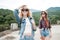 Two girls in hats traveling through ruins