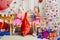 Two girls having fun and happy New Year gifts from Santa Claus bag