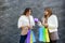 Two girls holding gift box. Celebration of the New Year or Christmas or birthday. Giving a present