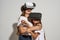 Two girls hug during use virtual reality headset