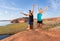 Two Girls Jumping for Joy in the Desert