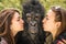 Two Girls kissing an astonished Gorilla