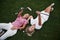 Two girls lie on the golf course and relax after the game