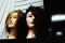 Two girls mannequin heads with wavy hairstyles. Fashion and beauty