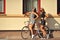 Two girls near a vintage bike