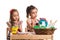 Two girls painting Easter eggs